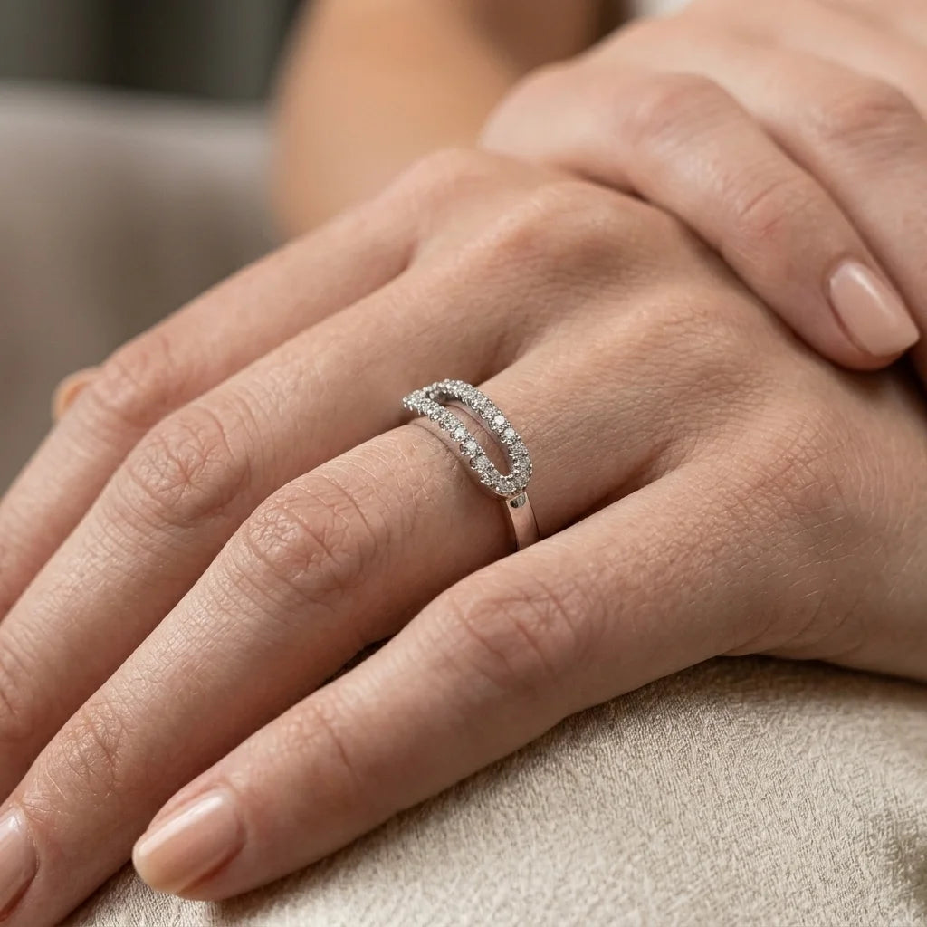 Luxury silver ring showcasing parallel rows of clear gemstones in oval shape.