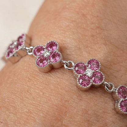 Women’s pink flower bracelet with sparkling pink and white stones, elegant silver jewelry
