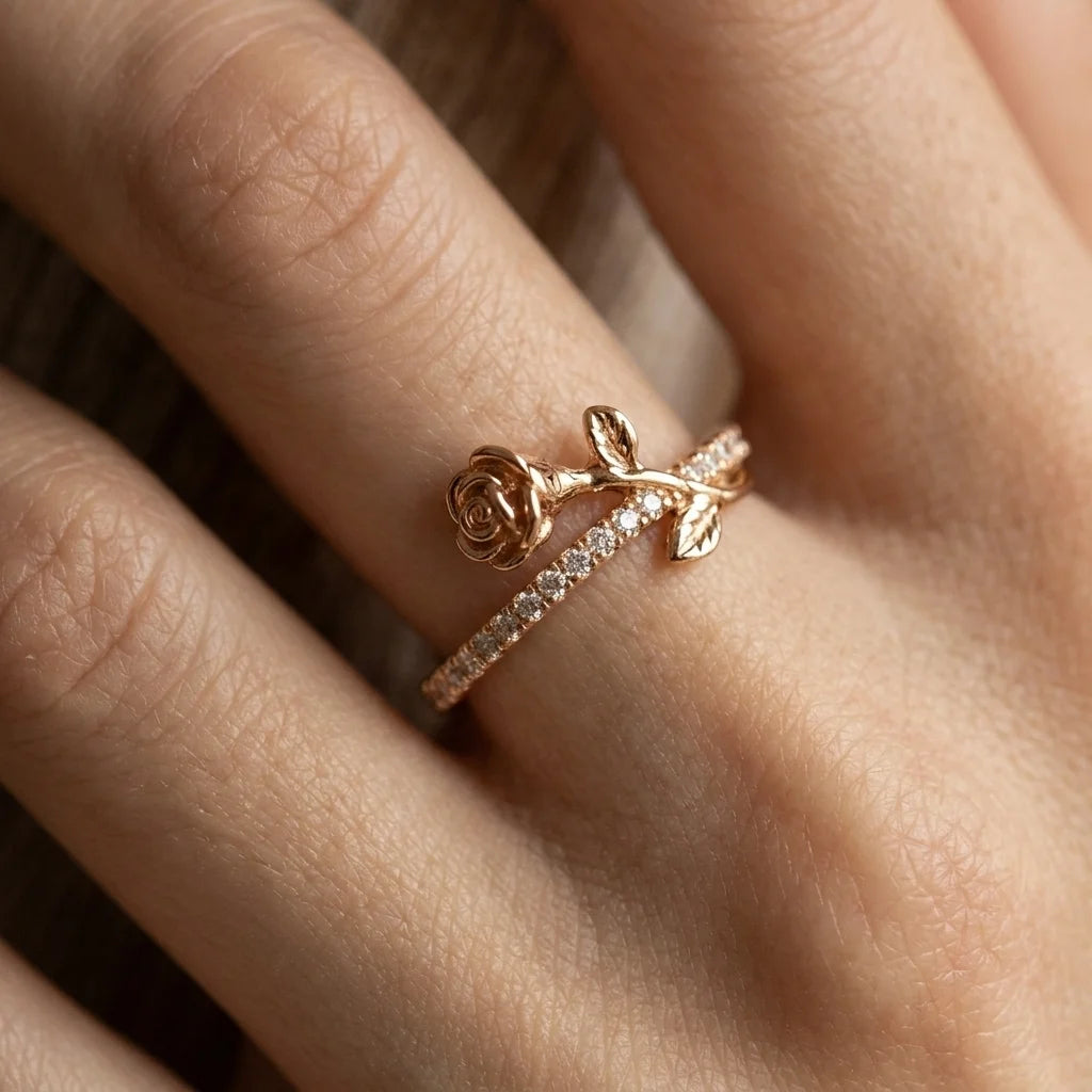 Close-up of gold Luminous Rosa double-band ring with bow detail and crystal-set band