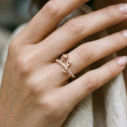 Luminous Rosa adjustable gold ring with bow-style top and sparkling band worn on a woman's finger