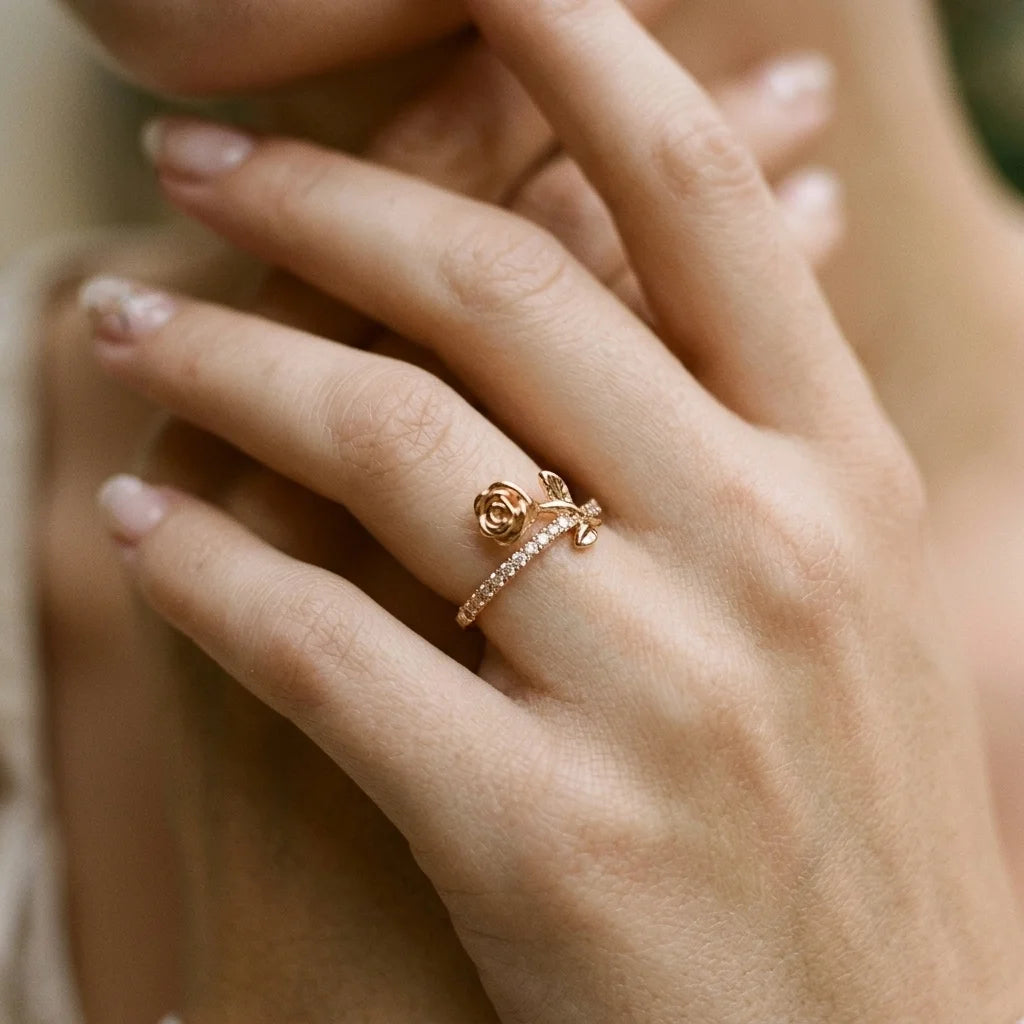Gold adjustable ring from Gemz By Purpuls worn on a hand held near the face