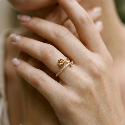 Gold adjustable ring from Gemz By Purpuls worn on a hand held near the face