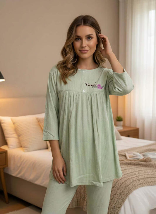 Woman wearing light green Purpuls gown pajamas in a cozy bedroom