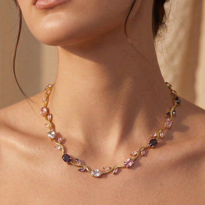 Necklace with multicolored gemstones on a person's neck against a neutral background