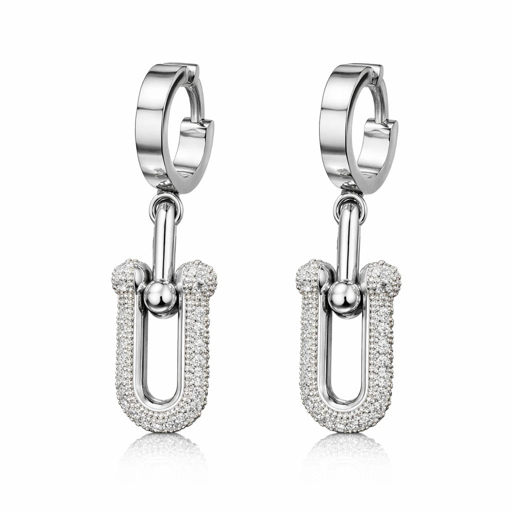 Pair of silver hoop earrings with U-shaped pendants on a white background