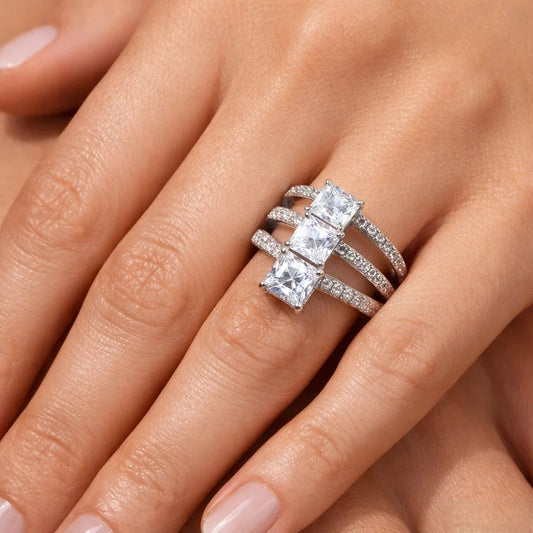 Silver ring with multiple diamonds on a hand