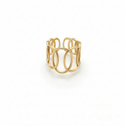 Gold ring with a modern design on a white background